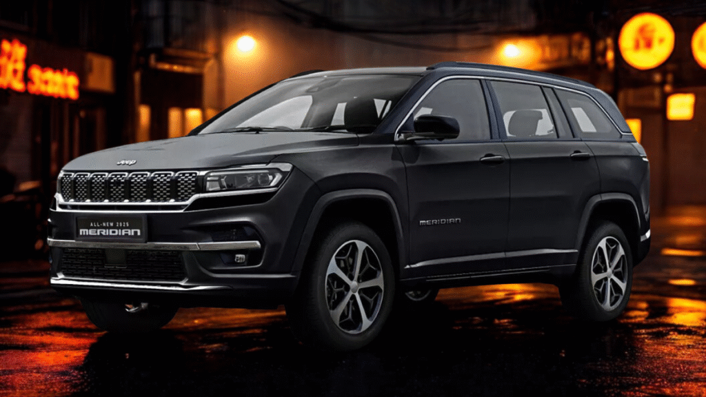 Black Jeep Meridian SUV at night in a moody urban alley with neon lights and wet roads – bold design meets after-dark adventure.