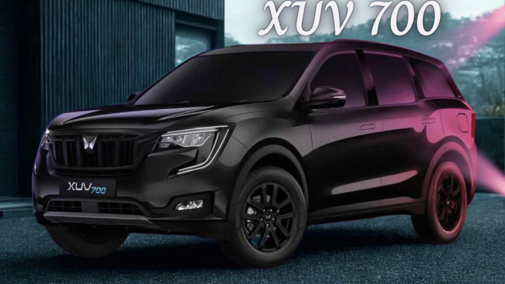XUV700 SUV navigating snowy trail in alpine mountain region during winter