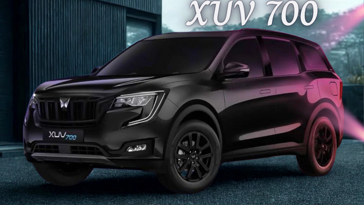 XUV700 SUV navigating snowy trail in alpine mountain region during winter