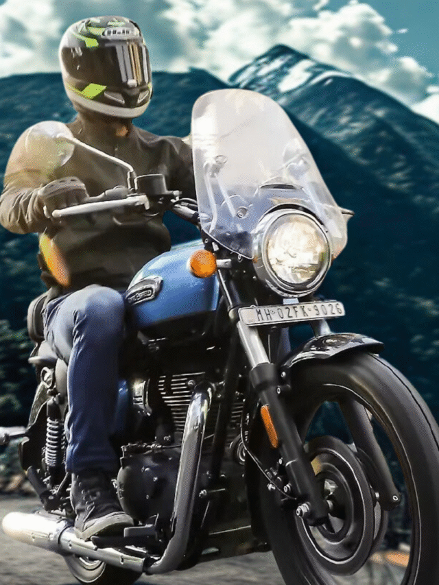 Royal Enfield Meteor 350 Aurora Blue cruising on a mountain road surrounded by mist and pine trees, symbolising viral buzz and touring appeal.